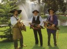 Three hurdy-gurdy players