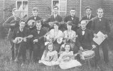 A mixed mandolin band with a snare drummer